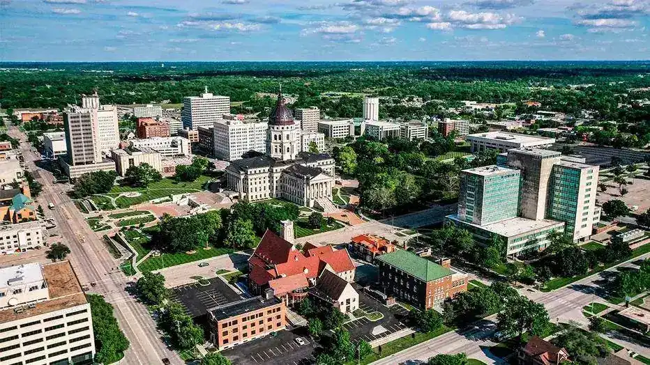 Aerial view of downtown Topeka, Kansas, with the Kansas State Capitol dome at its center